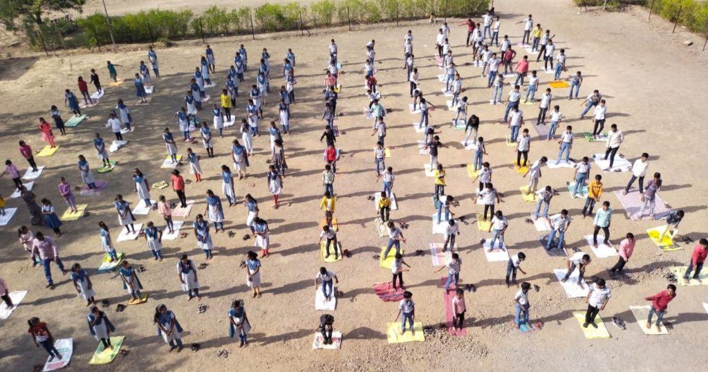 Yoga Day was celebrated with enthusiasm in Jamkhed taluka, yoga practitioner Santosh Thorat gave yoga lessons to students, Jamkhed news today,